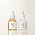 two bottles of liquid with a dropper