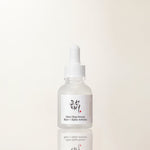 a white bottle with a dropper