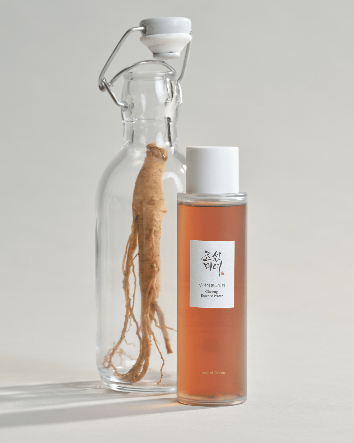 a bottle of liquid and a root